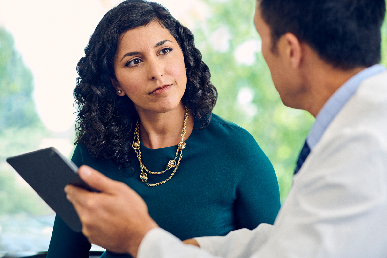 Surgeon consulting with patient